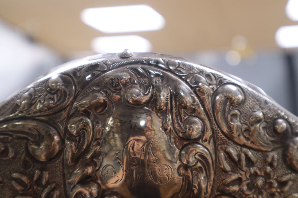 An Edwardian repousse silver mounted easel mirror by A & J Zimmerman, Birmingham, 1904, 55.6cm.